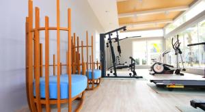 a gym with several exercise equipment in a room at The Sea B36 in Sam Roi Yot