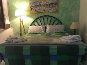 Кровать или кровати в номере Casa La Pelosa Beach