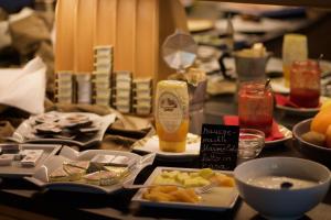 a table topped with plates of food and drinks at Cafe Schneider in Lappago