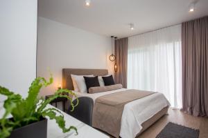Postel nebo postele na pokoji v ubytování Villa Blanka