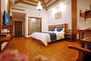 Llit o llits en una habitació de Guihua Road 106th Hostel