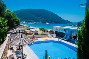 a swimming pool with a view of the water at Ponti Beach Hotel in Vasiliki