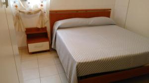 Ein Bett oder Betten in einem Zimmer der Unterkunft Casa Vacanze Margherita - Sasso di Castalda