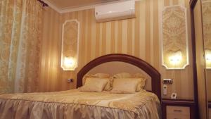 a bedroom with a bed with two pillows on it at Villa SportLife in Lloret de Mar