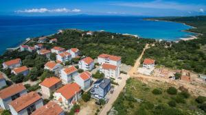 an aerial view of a village on an island in the ocean at Villa Ave in Novalja