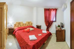 Postel nebo postele na pokoji v ubytování Garibaldi Relais + 37 fotografií