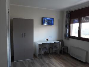Televízia a/alebo spoločenská miestnosť v ubytovaní AF service b&b