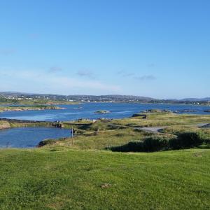 a view of a river from a grassy field at Tidal View in Kincasslagh