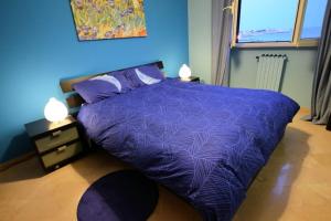 Postel nebo postele na pokoji v ubytování B&B LA BAIA Sea Rooms