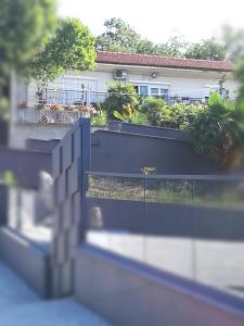 a fence in front of a house at Flumine in Rijeka