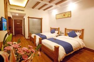 Llit o llits en una habitació de Guihua Road 106th Hostel