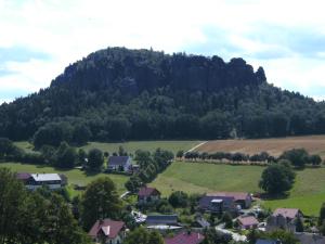 a village in front of a mountain at Ferienwohnung Familie Arlt in Königstein an der Elbe