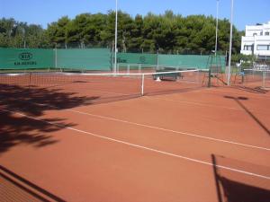 a tennis court with a net on a court at Oasis Lagoon Estate in Venice-Lido