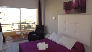 Postel nebo postele na pokoji v ubytování Hotel Carlos I