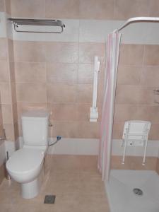 a bathroom with a toilet and a shower at Element Hotel in Elafonisos