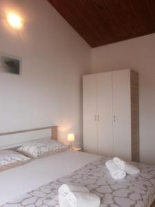 Postel nebo postele na pokoji v ubytování Apartmani Ljubica