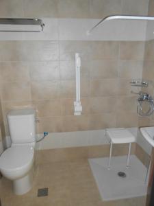 a bathroom with a toilet and a sink at Element Hotel in Elafonisos