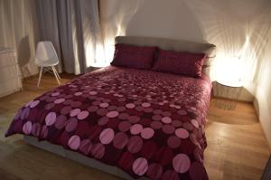 Un pat sau paturi într-o cameră la Il Portico di Saragozza