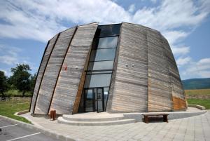a building with a large window on top of it at Apartments 18 in Velingrad