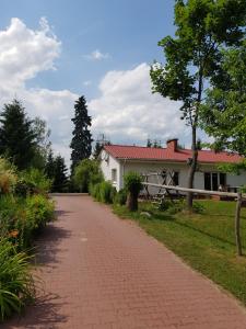 a brick road in front of a house at Ranczo u Nikodema in Silice