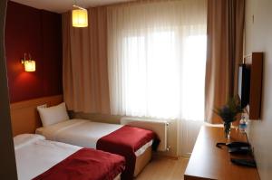 Postel nebo postele na pokoji v ubytování Cetinkaya Hotel