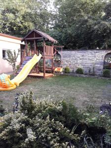 a playground with a slide and a gazebo at Celebrity in Kamianets-Podilskyi