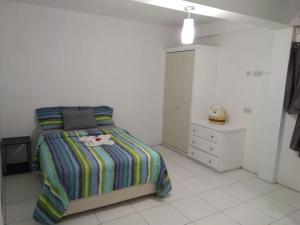 Tempat tidur dalam kamar di Caribbean Dream Vacation Property CD4