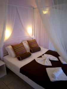 Ένα ή περισσότερα κρεβάτια σε δωμάτιο στο Creta Suites