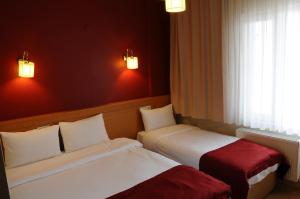 Postel nebo postele na pokoji v ubytování Cetinkaya Hotel