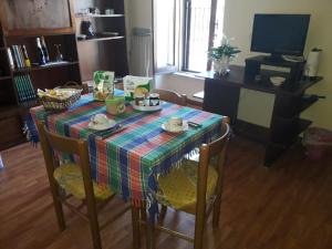 a dining room table with a platter of food on it at Nonna Bruna in Rieti