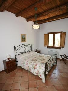 A bed or beds in a room at La Neffola Residence