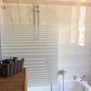 a bathroom with a shower and a bath tub at villa Vanelle in Isola delle Femmine