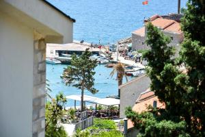 a view of a harbor with boats in the water at Apartments Minja S in Petrovac na Moru