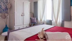 a bedroom with a bed with a stuffed animal on it at Le Terrazze in Otranto