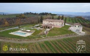 an aerial view of a house in a vineyard at Relais Pugliano in Monterappoli