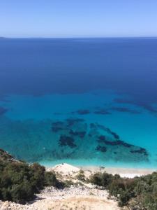 an aerial view of a island in the ocean at Villas Ermali in Ksamil