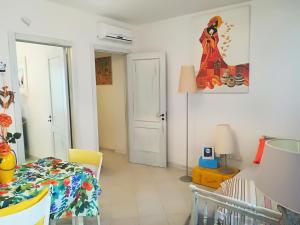 a dining room with a table and a room with at Le Terrazze in Otranto