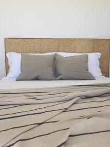 Postel nebo postele na pokoji v ubytování Island White