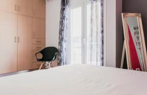 Кровать или кровати в номере Veranda Apartment
