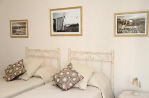 A bed or beds in a room at B&B Evelyne