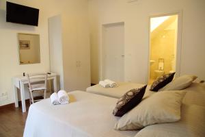 A bed or beds in a room at B&B Evelyne