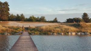 a wooden bridge over a body of water at Gabriela in Nin