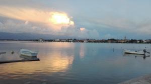 two boats are docked on a lake with a sunset at Gabriela in Nin +9 photos