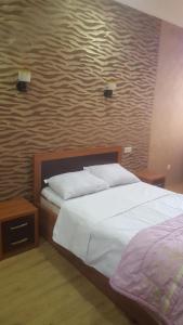 Posteľ alebo postele v izbe v ubytovaní Baratashvili 29 Apartment