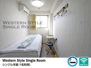 Postel nebo postele na pokoji v ubytování Hotel Raizan North