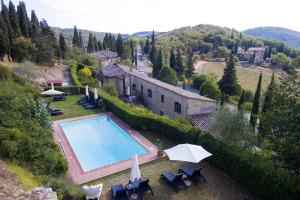 an aerial view of a house with a swimming pool at Residenzia Del Sogno in Castellina in Chianti