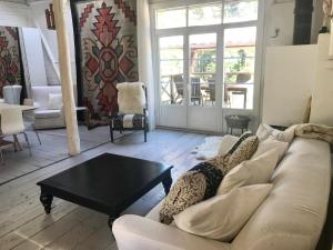 a living room with a couch and a coffee table at Björnåsen Bear Hill in Katrineholm