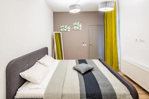 Кровать или кровати в номере Apart Hotel Code 10