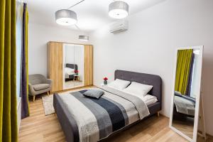 Кровать или кровати в номере Apart Hotel Code 10