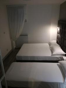 Ліжко або ліжка в номері Una Riga sul Mare